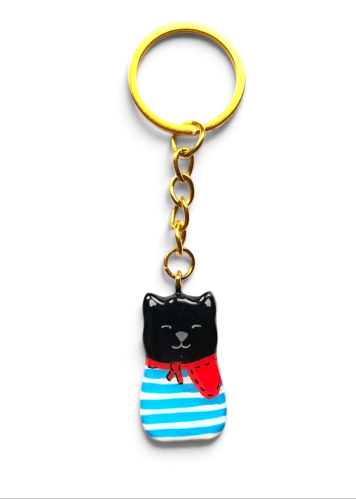 Porte-clé Lucky Rolie Cat Gabin — petit chat noir breton en marinière bleue et foulard rouge, modelé et peint à la main en argile, fini à la résine UV. Fait main au Cap Sizun.