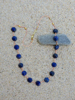 collier porte bonheur lapis lazuli sur cordon